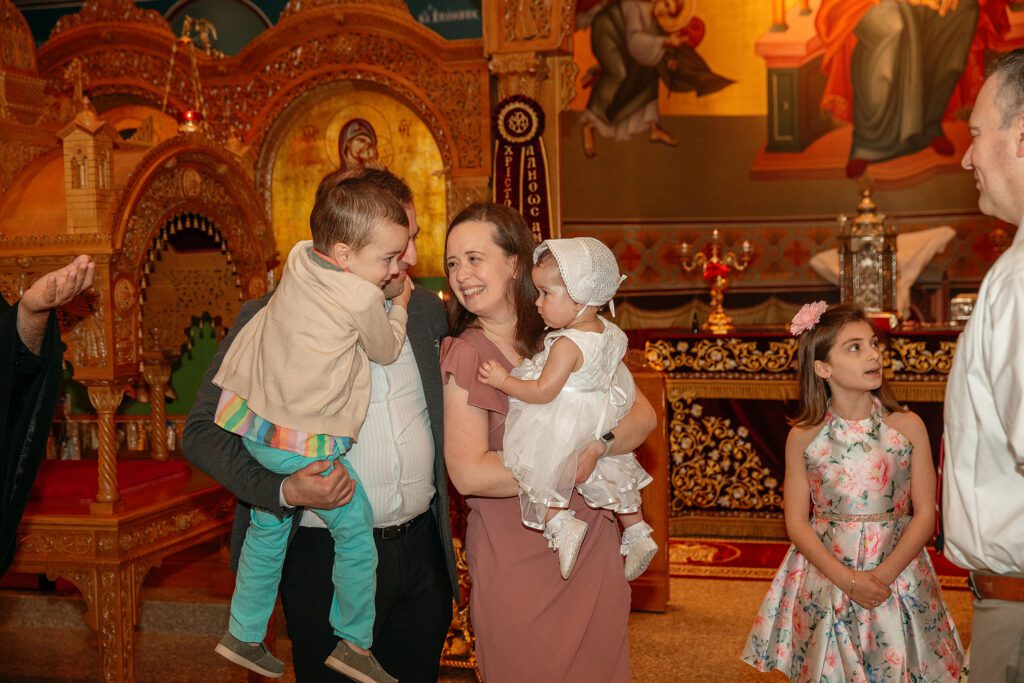 reunited family after baptism at St. Nectarios Greek Orthodox Church in Palatine IL