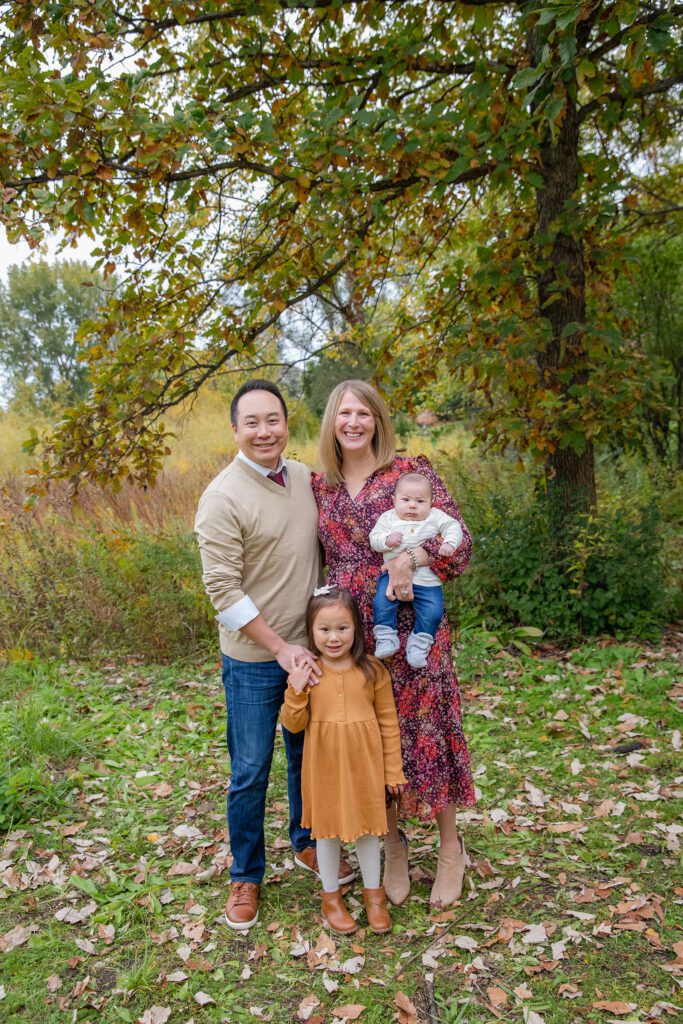 new family of 4 in park in palatine, IL photograph taken by Just Peachy Photography