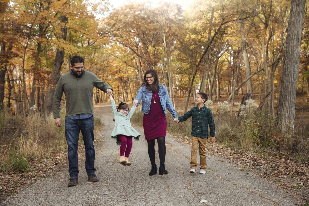 family of 4 has fun for fall photos in Palatine, IL with photographer Just Peachy Photography
