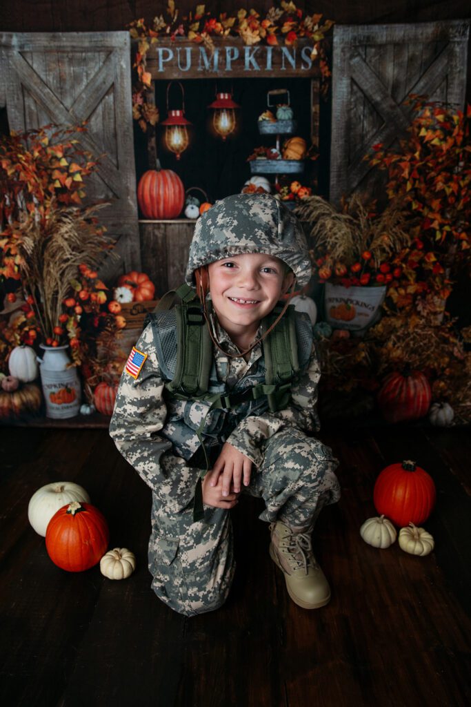 Boy in paratrooper costume at Palatine Halloween event at Just Peachy Photography studio