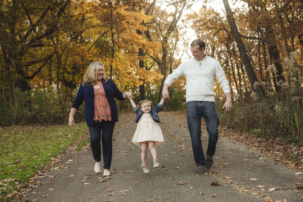 family of 3 in forest preserve in palatine, IL photograph taken by Just Peachy Photography