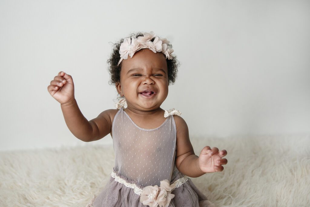 baby girl laughing at Just Peachy Photography Baby Portrait Studio in Palatine IL | baby milestone portraits