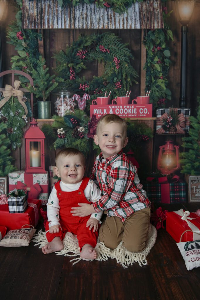 two young boys have fun at the holiday mini session with fun colors | Just Peachy Photography Palatine IL